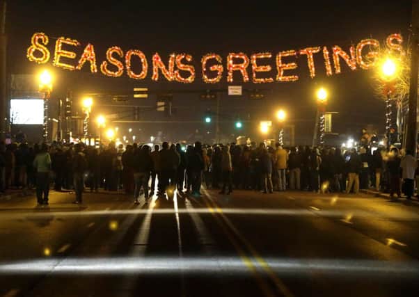 Protesters gather in front of the Ferguson Police Department on Tuesday night. Picture: AP