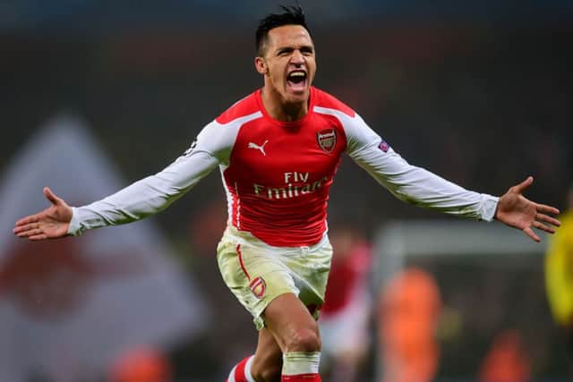 Arsenal's Alexis Sanchez celebrates scoring his side's second goal against Borussia Dortmund. Picture: PA