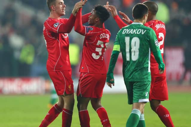 Jordan Henderson, left, of Liverpool celebrates scoring his side's second goal with Raheem Sterling. Picture: Getty