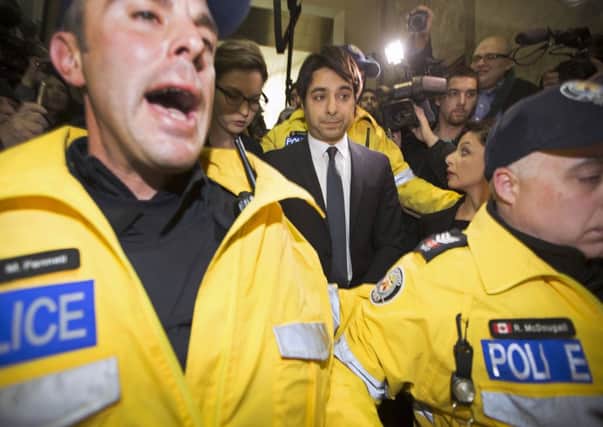Former CBC radio host Jian Ghomeshi leaves court in Toronto after receiving bail yesterday. Picture: Reuters