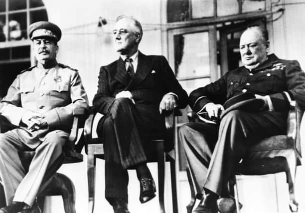 On this day in 1943, the Big Three  Allied leaders (from left) Stalin, Roosevelt and Churchill  held a summit in Tehran. Picture: Getty
