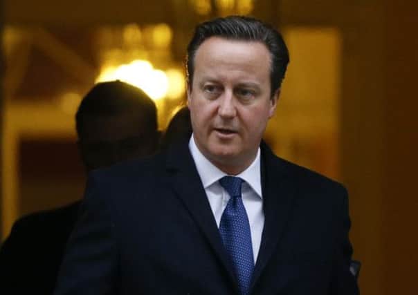 David Cameron: Under scrutiny over 'broken' immigration pledge. Picture: AP