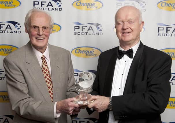 Archie MacPherson presents Montford with a Special Merit Award. Picture: SNS
