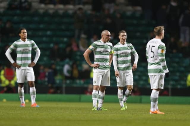 Virgil van Dijk, Scott Brown, Stefan Johansen and Kris Commons look dejected after Celtic's defeat. Picture: PA