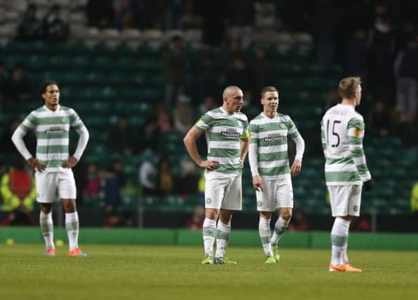 Virgil van Dijk, Scott Brown, Stefan Johansen and Kris Commons look dejected after Celtic's defeat. Picture: PA