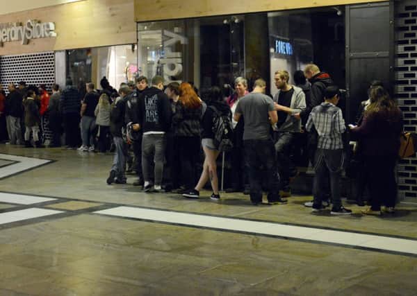 Shoppers queue outside stores awaiting Black Friday. Picture: SWNS