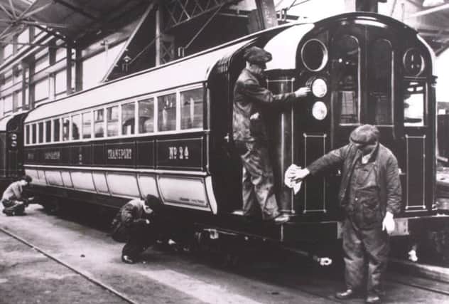 Glasgow Subway workers prepare a train for electrificiation in 1935. Picture: TSPL