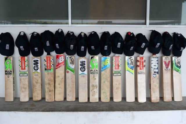 England put their bats out in a gesture in memory of Phil Hughes. Picture: Getty