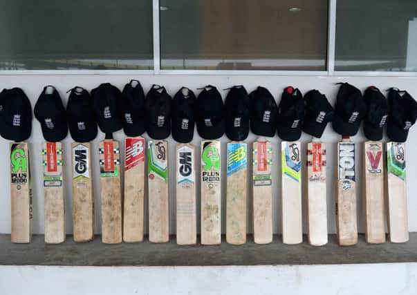 England put their bats out in a gesture in memory of Phil Hughes. Picture: Getty