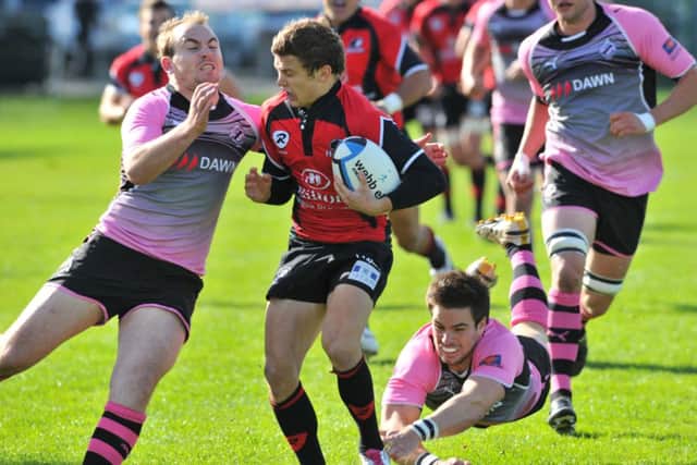 Craig Gossman, as a Hawk, is tackled by AJ MacFarlane of Ayr in a 2010 match-up. Picture: Robert Perry