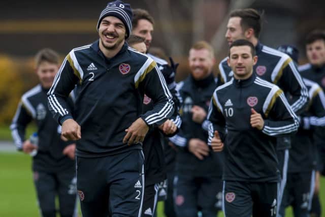 Right-back Callum Paterson leads from the front as the Hearts squad. Picture: SNS