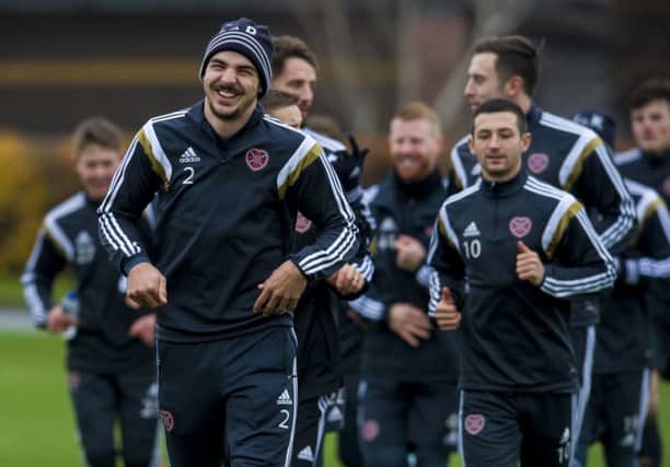 Right-back Callum Paterson leads from the front as the Hearts squad. Picture: SNS