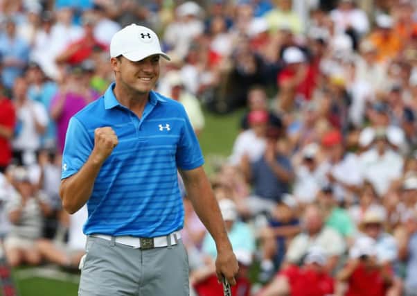 Jordan Spieth celebrates after carding a final-round 63 to win the Australian Open by six strokes. Picture: Getty