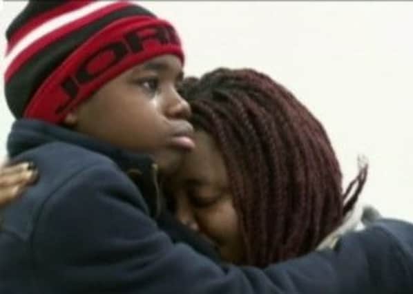 The teenage boy is reunited with his mother in Atlanta after being rescued from the house. Picture: Contributed