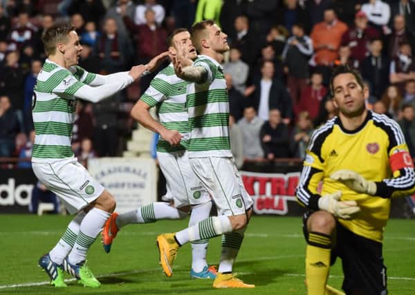 Celtic's John Guidetti celebrates having delivered from the penalty spot to double the lead for his side 0-2. Picture: SNS