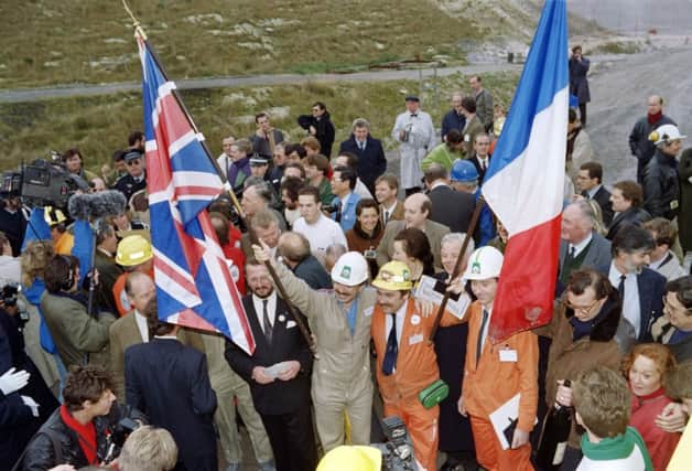 A French worker and his British counterpart meet on this day in  1990 during the historic breakthrough in the Channel Tunnel. Picture: Getty