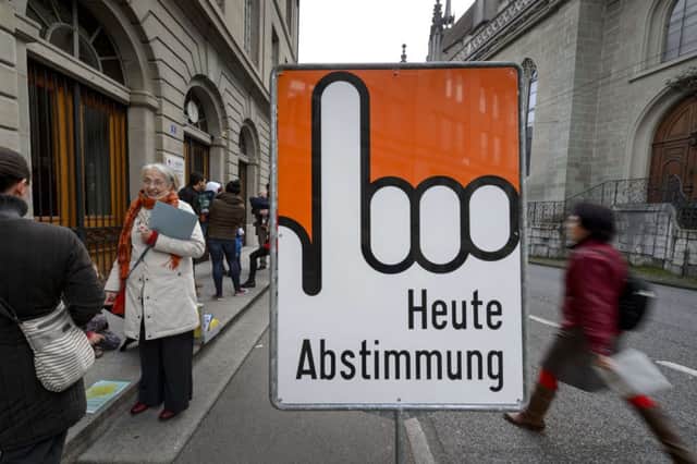 A sign reads Vote Today in Fribourg as the Swiss head to the polls yesterday. Picture: Getty