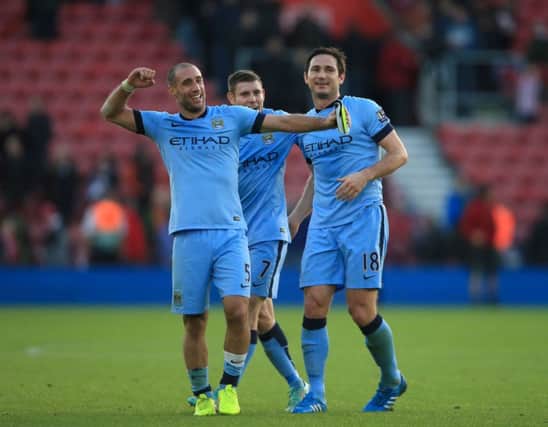 Frank Lampard, right, scorer of Citys second goal, celebrates with Pablo Zabaleta, left, and James Milner. Picture: PA