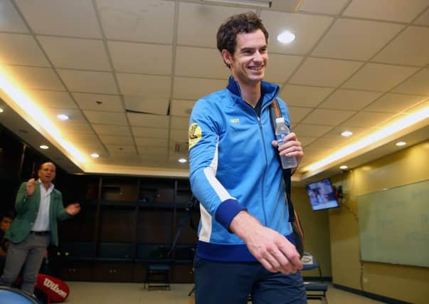 A smiling Andy Murray leaves the changing rooms ahead of his singles match against Nick Krygios. Picture: Getty