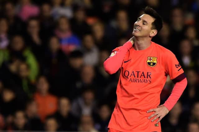 Lionel Messi was celebrating Barcelona's winner when he was struck by a bottle. Picture: Getty