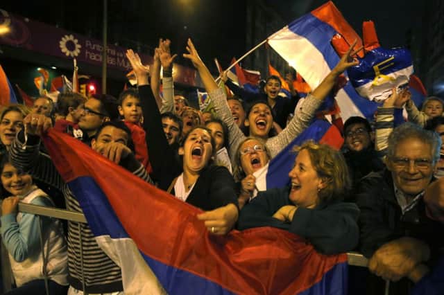 Broad Front coalition supporters celebrate the election of Tabare Vazquez. Picture: Reuters