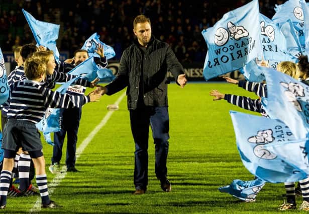 Dan Parks receives the adulation of  Glasgow Warriors youngsters when he visits his old pro team. Picture: SNS