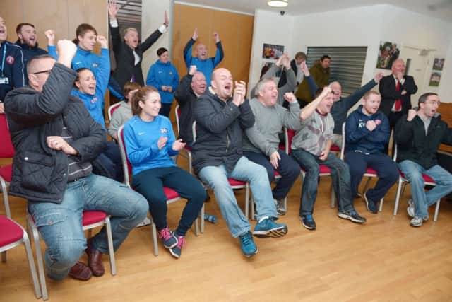 Spartans officials and fans cheer with joy watching the Scottish Cup draw inside their academy complex yesterday. Picture: Phil Wilkinson