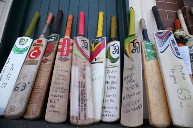 Bats with messages are lined up as a tribute for Phillip Hughes at the Sydney Cricket Ground. Picture: AP