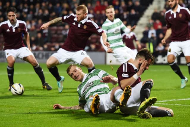 Guidetti went down in the area despite there being no contact made on him by Brad McKay. Picture: SNS