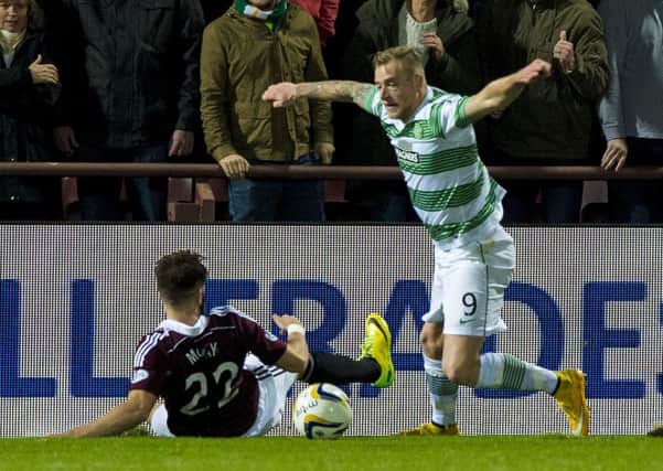Celtic's John Guidetti is challenged in the box by Heart's Brad McKay before being awarded a penalty. Picture: SNS