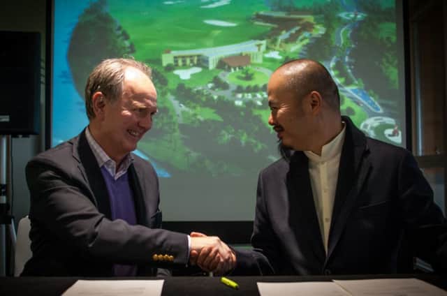 Links Trust chief executive Euan Loudon, left, and White Horse Holdings co-founder Zi Ding Han shake hands on their partnership