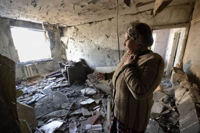 A woman stands in the ruins of her flat in eastern Ukraine where pro-Russian rebels and Ukrainian troops are still at loggerheads. Picture: Getty
