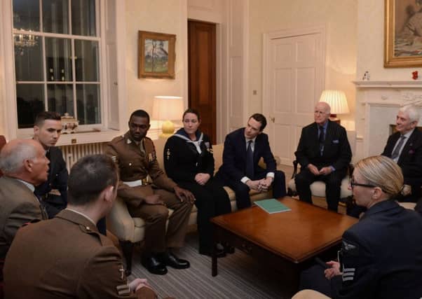 Chancellor George Osborne discusses the allocation of money from Libor fines to the armed forces yesterday. Picture: PA
