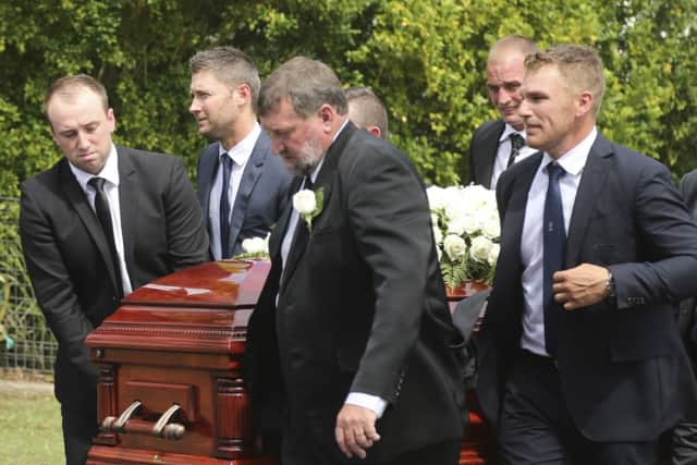 Pall bearers Jason Hughes, Michael Clarke, Gregory Hughes, Aaron Finch, and Corey Ireland carry the coffin of Phil Hughes. Picutre: AP