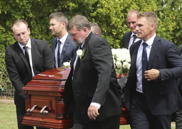 Pall bearers Jason Hughes, Michael Clarke, Gregory Hughes, Aaron Finch, and Corey Ireland carry the coffin of Phil Hughes. Picutre: AP