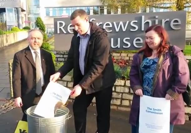 Brian Lawson, Will Mylet and Mags MacLaren burn the report. Picture: YouTube