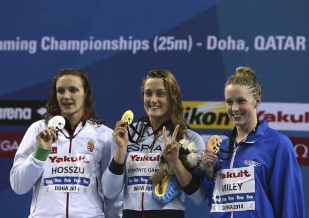 Hannah Miley, right, celebrates on the podium in Doha. Picture: Getty