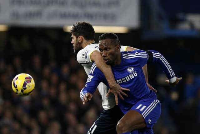 Didier Drogba, who scored Chelseas second, holds off Tottenham defender Federico Fazio. Picture: Getty