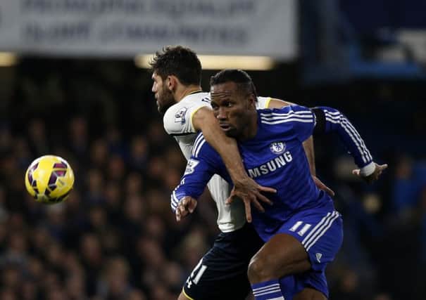 Didier Drogba, who scored Chelseas second, holds off Tottenham defender Federico Fazio. Picture: Getty