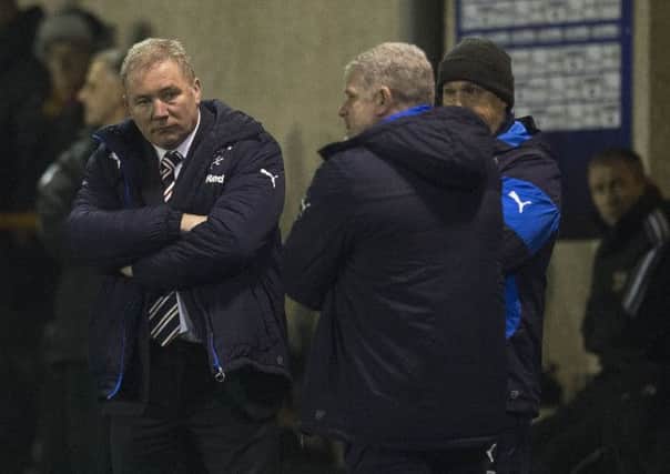 Ally McCoist cuts a dejected figure in the dugout last night. Picture: SNS