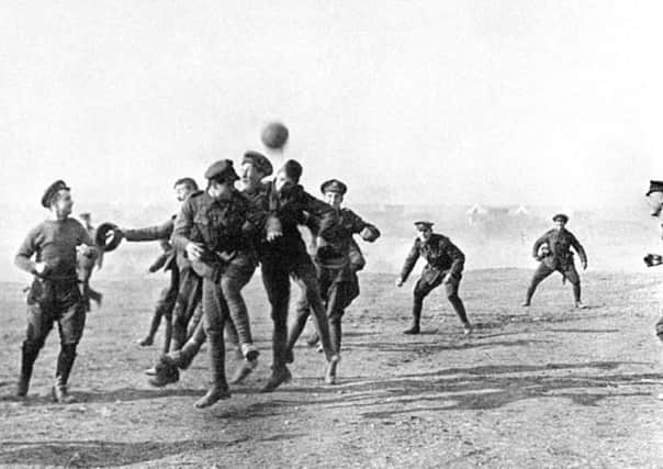 British and German soldiers put down their guns for football. Picture: PA