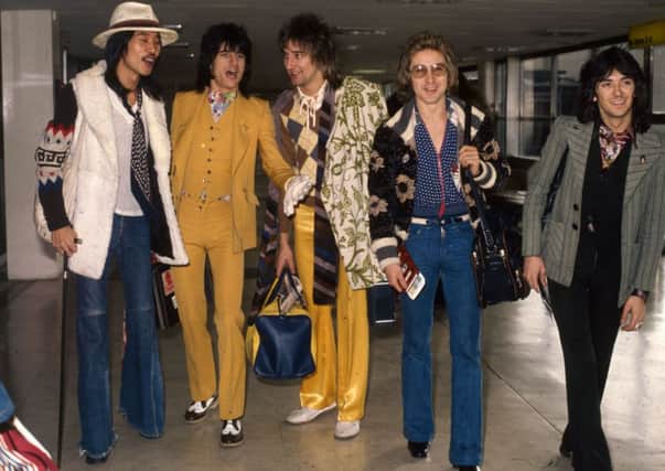 The Faces at London Airport, later Heathrow, in 1974  from left, Tetsu Yamauchi, Ronnie Wood, Rod Stewart, Kenny Jones and Ian McLagen. Picture: Getty