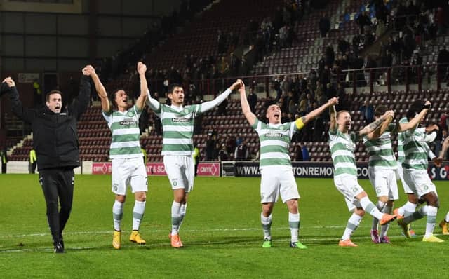 Celtic manager Ronny Deila celebrates with his players following their defeat of Hearts. Picture: SNS
