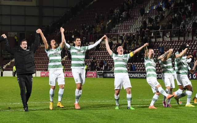 Celtic  manager Ronny Deila celebrates with his players following their defeat of Hearts. Picture: SNS