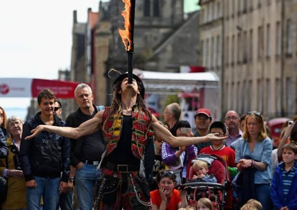 Edinburgh Festival Fringe entertainers perform on the Royal Mile. Picture: Getty