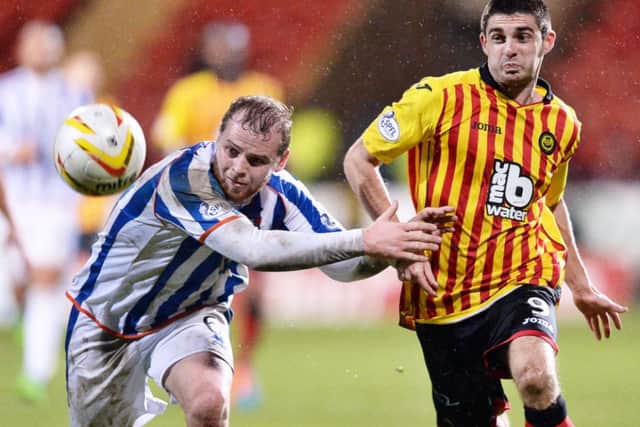 Kilmarnock's Mark Connolly holds off Kris Doolan. Picture: SNS