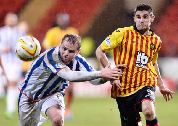 Kilmarnock's Mark Connolly holds off Kris Doolan. Picture: SNS