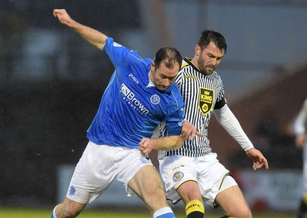 St Johnstone's Frazer Wright (left) and Steven Thomson battle for possession. Picture: SNS