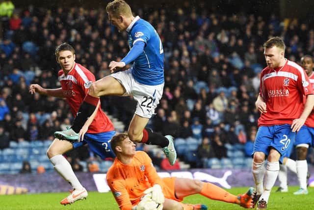 Cowdenbeath keeper Robbie Thomson slides out to thwart Dean Shiels. Picture: SNS