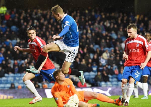 Cowdenbeath keeper Robbie Thomson slides out to thwart Dean Shiels. Picture: SNS